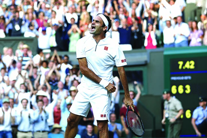 Switzerland's Roger Federer celebrates after beating Spain's Rafael Nadal in a Men's singles semifinal match on day eleven of the Wimbledon Tennis Championships in London on Friday.
