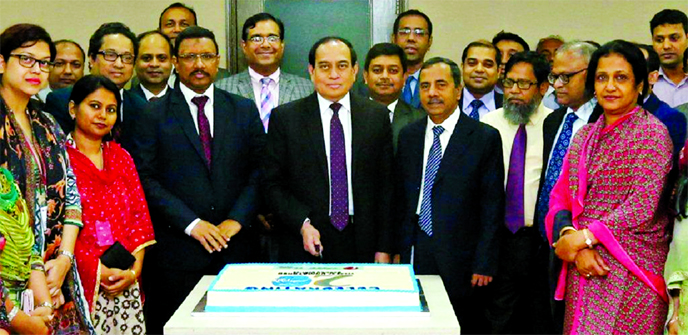 M Fakhrul Alam, Managing Director ONE Bank Ltd, cutting a cake to celebrate the Bank's 20th founding anniversary at its corporate office in the city on Saturday. The Bank started its journey on this in1999 as a private sector commercial bank.