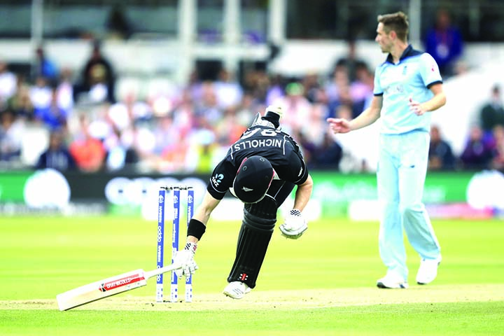 New Zealand's Henry Nicholls gets in safe to avoid a run out during the ICC World Cup Cricket final match between England and New Zealand at the Lord's cricket ground in London on Sunday.