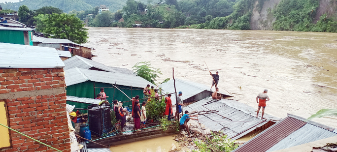 Low areas at Bandarban suffering a lot as most of the areas are flooded . This snap was taken from Marma Bazar on Sunday.
