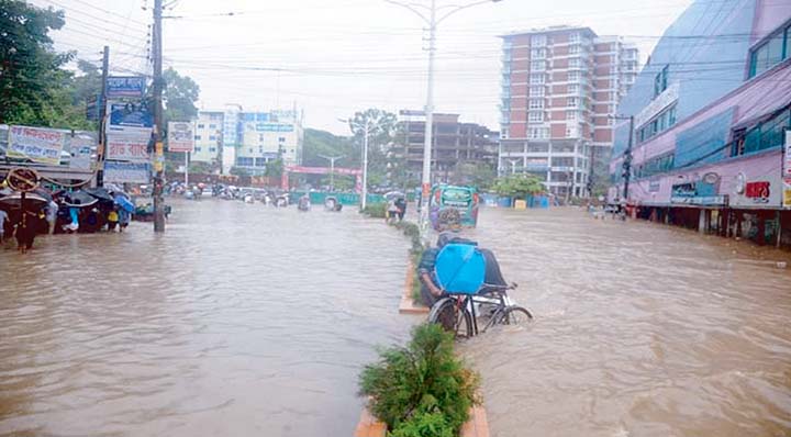 Pabartak area in the centre of the city near Medical College and Premier University went under waist deep water on Sunday.