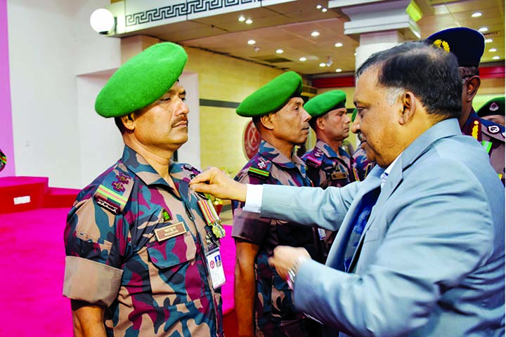 Home Minister Asaduzzaman Khan adorning BGB members with medals including Border Guard Bangladesh Medal, President Border Guard Medal and President Border Guard Medal Service for their contributions in Bir Uttam Fazlur Rahman Khondkar Auditorium of BGB He