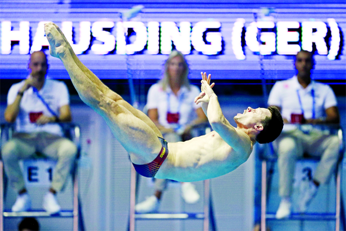 Patrick Hausding of Germany competes in the semifinals of men's 3-meter springboard diving at the World Swimming Championships in Gwangju, South Korea on Wednesday.