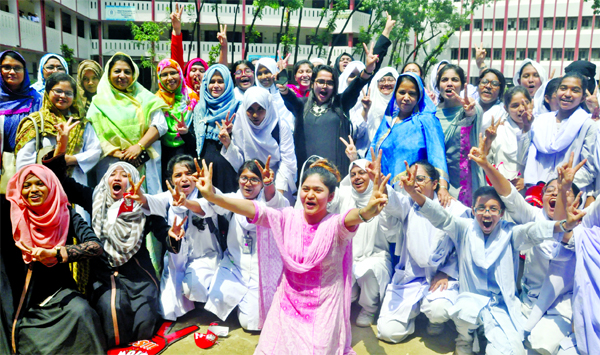 Students of the city's Motijheel Ideal School and College exulting over the brilliant results of the HSC examination. The snap was taken from the premises of the institution on Wednesday.