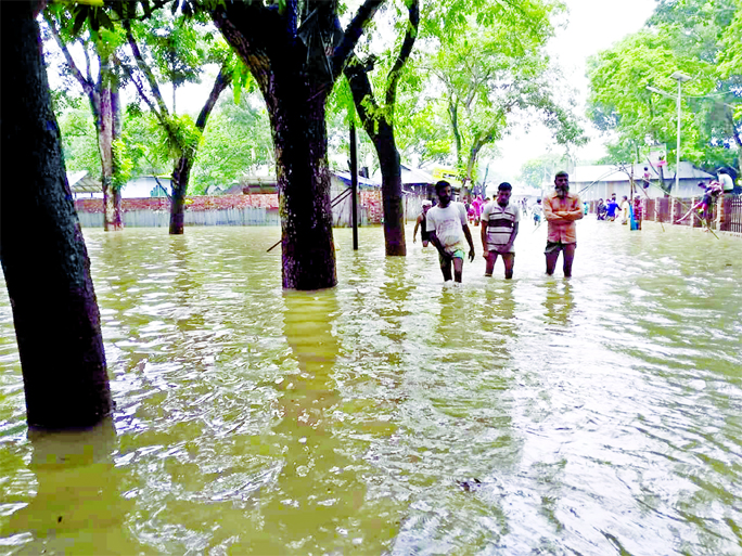 Thousands of people being marooned at Rajibpur Upazila of Kurigram due to onrush of flood water for a few days. This photo was taken from Kodalkati area on Wednesday.