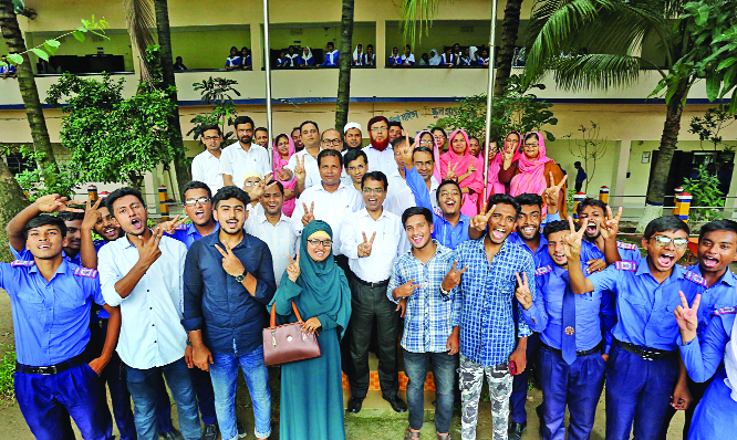 BOGURA: Jubilant students of Police Lines School and College posed for a photo session with Principal of the College after their brilliant HSC result on Wednesday.