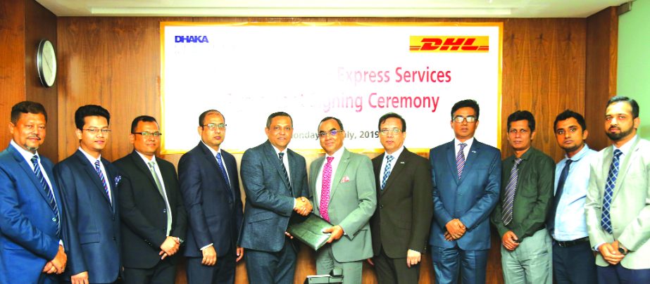 Syed Mahbubur Rahman, Managing Director of Dhaka Bank Ltd and Md Miarul Haque, Country Manager of DHL Worldwide Express (BD) Pvt. Ltd, exchanging a signing document for international correspondence and communication at the Bank's corporate office recentl