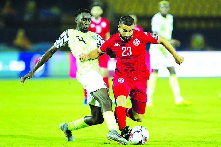 Tunisia's Naim Sliti (right) and Nigeria's Nididi Wilfred fight for the ball during the Africa Cup of Nations third-place soccer match between Nigeria and Tunisia in Al Salam stadium in Cairo, Egypt on Wednesday.
