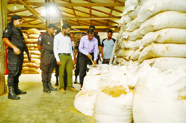 RAB-11 mobile team led by a magistrate raided a poultry and fish feed producing factory allegedly with tannery waste located at Siddhirganj in N'ganj and sealed the factory. Two persons were sent to jail. This photo was taken on Thursday.