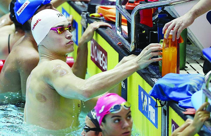 China's Sun Yang rests during a training session at the World Swimming Championships in Gwangju, South Korea on Saturday.