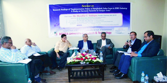 The view of a seminar on 'Implementing Labour Laws in the Garments Factory' held at BGMEA University of Fashion & Technology recently.