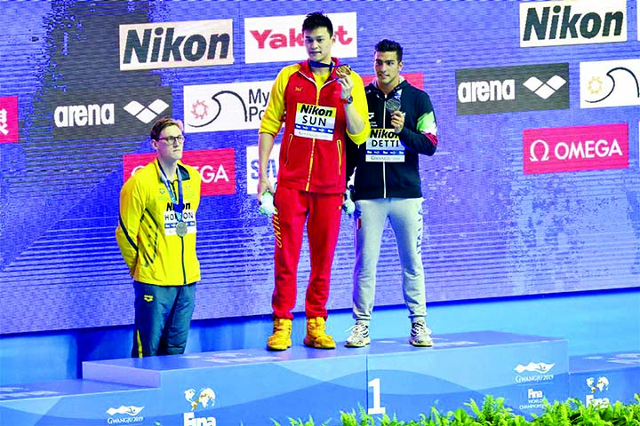 Silver medalist Mack Horton of Australia (left) refuses to stand on the podium with Gold medalist Sun Yang of China (center) and bronze medalist Gabriele Detti of Italy at the Men's 400m Freestyle Medal Ceremony in Gwangju, South Korea, on Sunday.