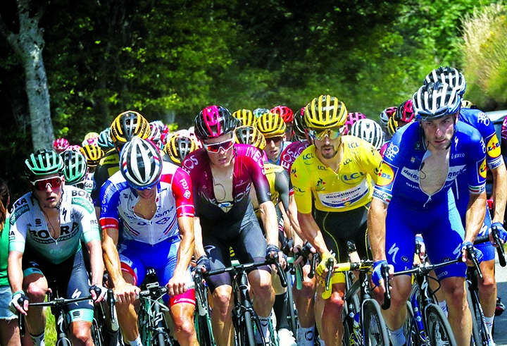 The pack with France's Julian Alaphilippe wearing the overall leader's yellow jersey rides during the fifteenth stage of the Tour de France cycling race over 185 kilometers (114,95 miles) with start in Limoux and finish in Prat d'Albis, France on Sunda