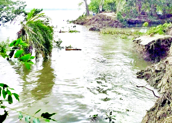 Road communications have been snapped as part of Wapda Road washed away by the onrush of flood water at Morelganj in Bagerhat. This photo was taken on Monday.