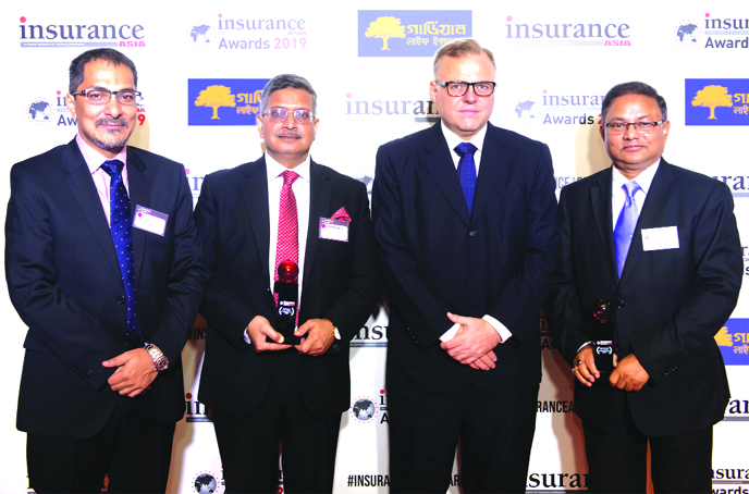 MM Monirul Alam, Managing Director of Guardian Life Insurance Ltd, poses along with Borhan Uddin Ahmed, Member (Law) of Insurance Development and Regulatory Authority (IDRA) and Syed Akthar Hasan Uddin, Director of Guardian Life glorified, after winning 2