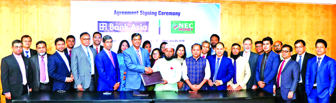 S M Iqbal Hossain, Head of International Business and Export Finance Department of Bank Asia Ltd and Ikram Farazy, Chairman and CEO of NEC Money Transfer Ltd, exchanging a signing document regarding remittance collection and payment at the Bank's Corpora