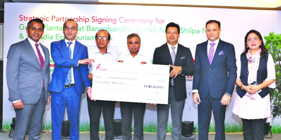 Mashrur Arefin, Managing Director of City Bank, and Paban Chowdhury, Executive Chairman of BEZA, exchanging an agreement signing document at the bank's corporate office in the city on Thursday. Abul Kalam Azad, Principal Coordinator (SDG) of Prime Minist
