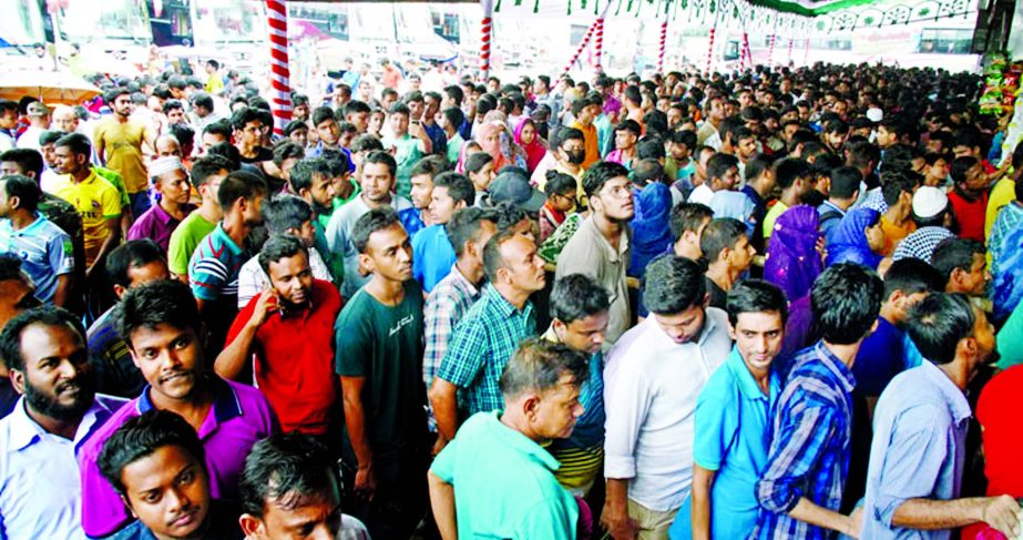 Thousands of home-goers thronged the Gabtoli Bus Terminal Counter to buy advance tickets for celebrating Eid-ul-Azha with their near and dear ones. This photo was taken on Friday.