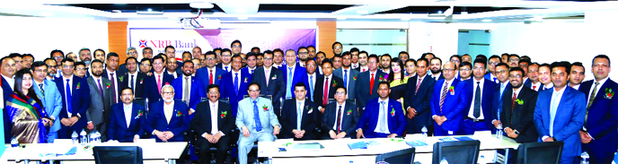 Mohammed Mahtabur Rahman, Chairman of NRB Bank Ltd, poses along with Tateyama Kabir, Vice-Chairman, Md Mehmood Husain, CEO, M Badiuzzaman, EC Chairman and other directors of the Bank after attending at its Half Yearly Business Review Meeting 2019 at a cit