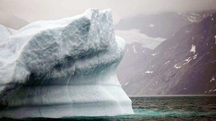 A melting iceberg floats along afford leading away from the edge of the Greenland ice sheet near Nuuk, Greenland.