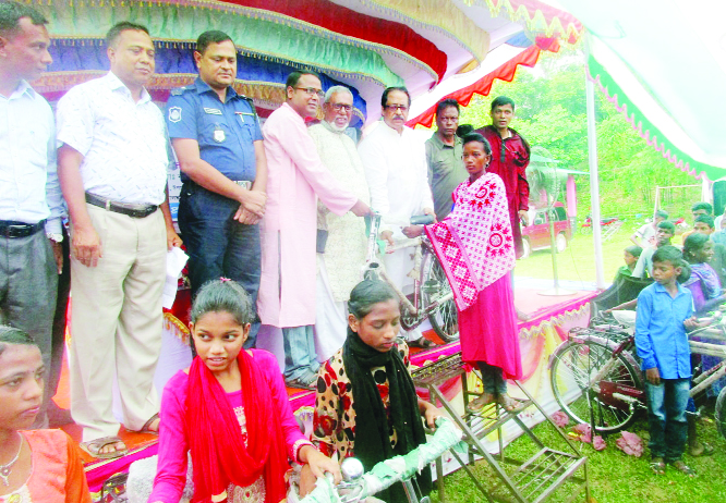 SYLHET: Mahmud us Samad Chowdhury MP distributing bicycles among the students of Monipur Cha Baghan Primary School at Fenchuganj Upazila as Chief Guest recently.