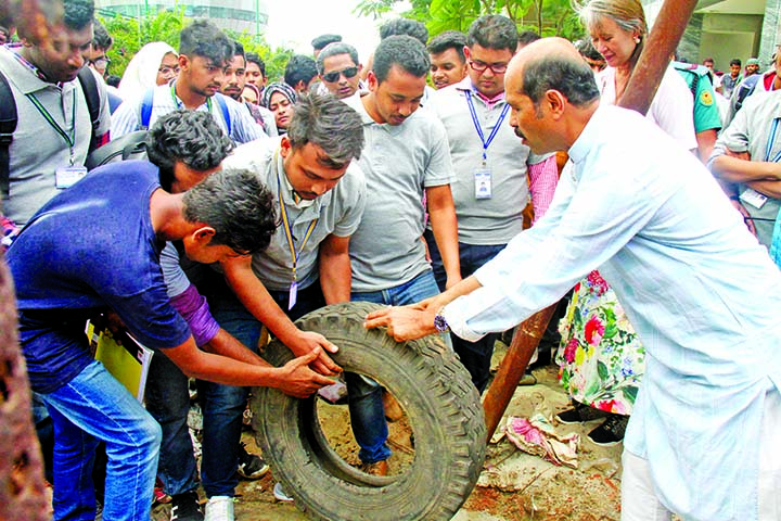 DNCC Mayor Md Atiqul Islam led a cleanliness drive by students on America International University campus in the city yesterday .