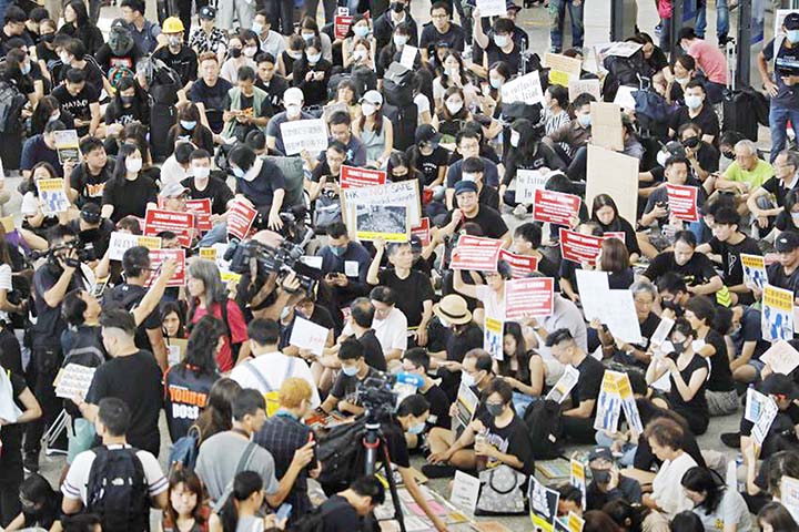 Demonstrators gather during a protest at Hong Kong International Airport on Sunday.