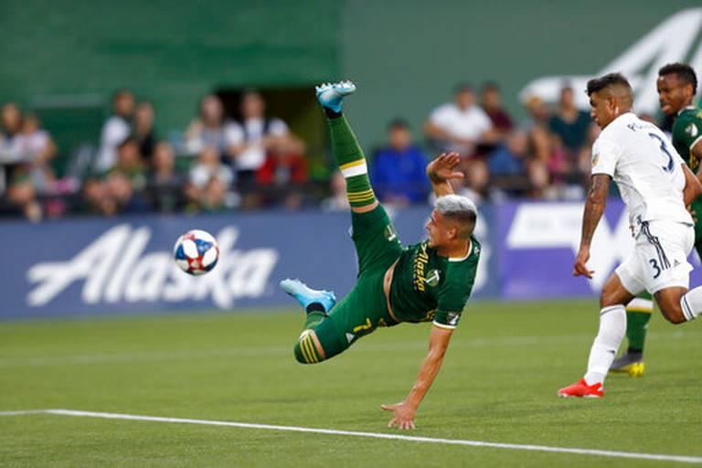 The Portland Timbers' Brian Fernandez (7) jumps for the ball during the first half of an MLS soccer match against the LA Galaxy in Portland, Ore. on Saturday.