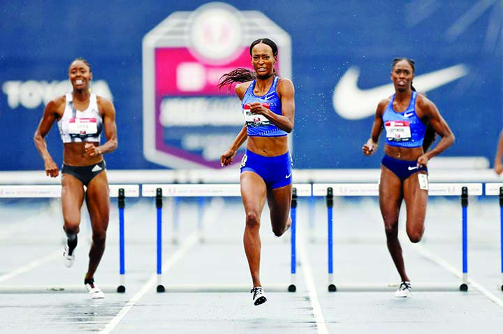 Dalilah Muhammad (center) eyes the finish line as she wins the women's 400-meter hurdles at the U.S. Championships athletics meet in Des Moines, Iowa on Sunday. She lowered the world record to 52.20 seconds.