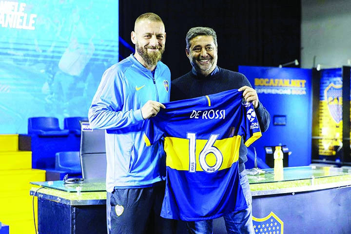 Daniele De Rossi poses next to Daniel Angelici Boca Juniors president (right) in Buenos Aires, Argentina on Monday. The former Roma captain and 2006 World Cup winner De Rossi signed with Boca Juniors in a one-year deal.