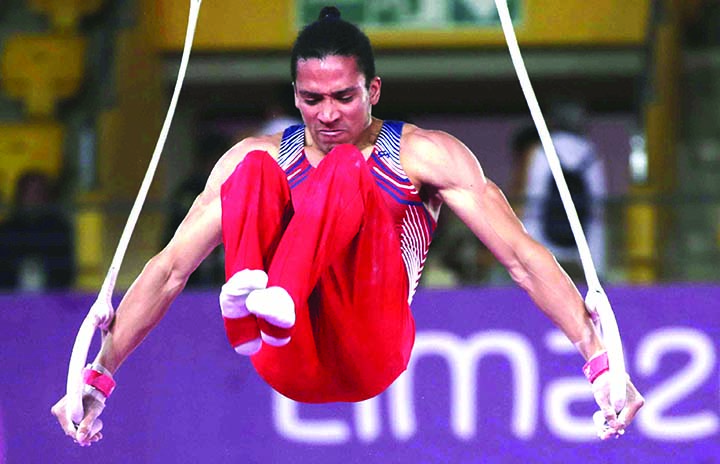 Adickxon Trejo of Venezuela competes on the rings in the men's gymnastics individual all-around final at the Pan American Games in Lima, Peru on Monday.