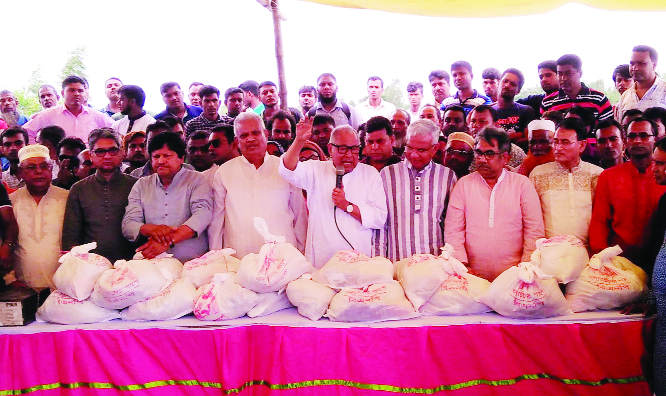 MELANDAH(Jamalpur): Nazrul Islam Khan, Member of Standing Committee of BNP addressing a meeting during relief distribution programme at Melandah Upazila on Sunday.