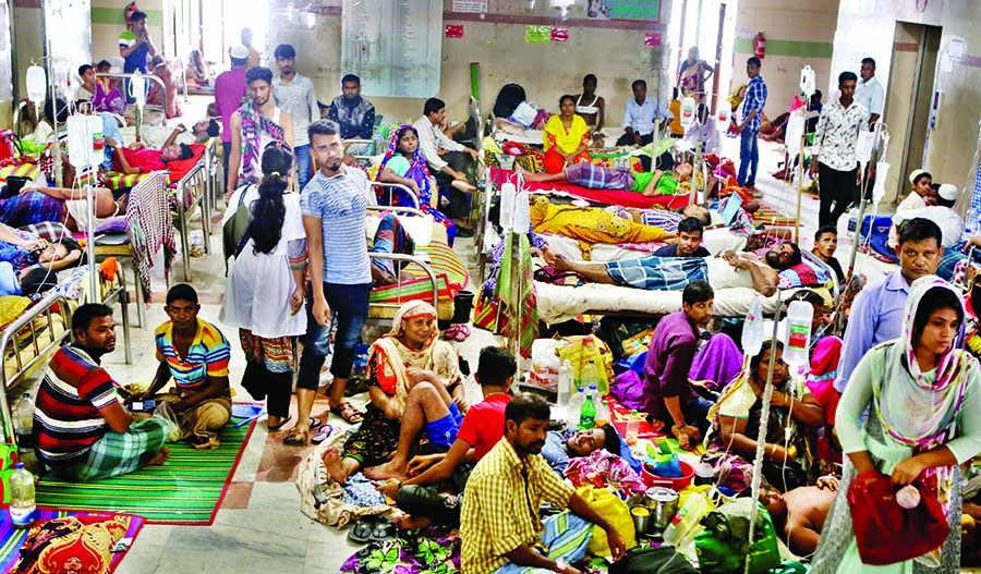 As beds continued to remain full, the new dengue patients were accommodated on the floor in city hospitals. The photo was taken from Dhaka Medical College Hospital on Tuesday.