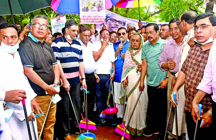 Road Transport and Bridges Minister and General Secretary of Awami League Obaidul Quader speaking at the inaugural ceremony of cleanliness campaign organised by the party to resist dengue. The snap was taken from in front of the party office in the city'
