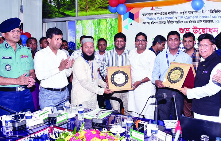 SYLHET: Foreign Minister Dr AK Abdul Momen and State Minister for ICT Junaid Ahmed Palak being presented crest at the inaugural ceremony of IP Camera-based CCTV System under Digital Sylhet City Project at Sylhet recently.