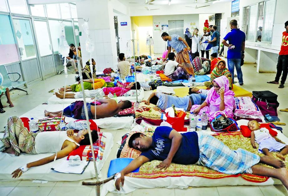 Hundreds of dengue patients taking treatment from the floor as there are no beds available for the new patients rush to the hospital. This photo was taken from Mitford hospital on Wednesday.