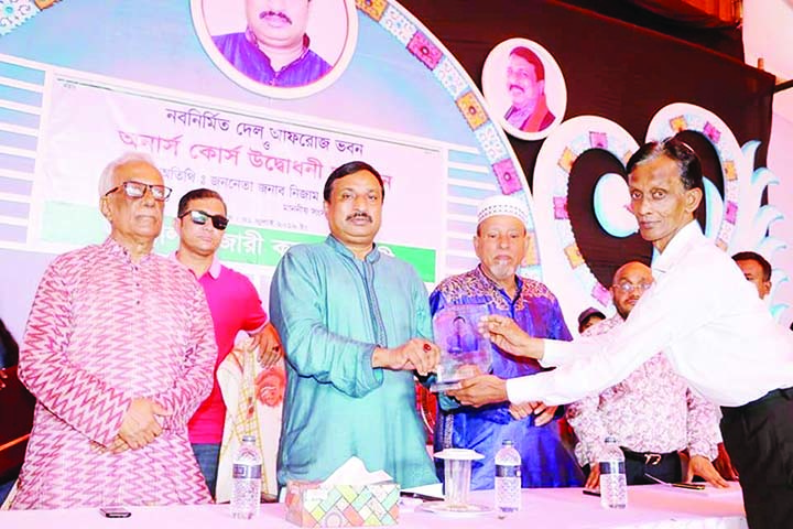 FENI: Nizam Uddin Hazari MP being greeted by Aziz Ahmed Chowdhury , Chairman, Feni Zilla Parishad at the inaugural programme of new academic building and Honours Course of Hazari College at Feni on Wednesday.