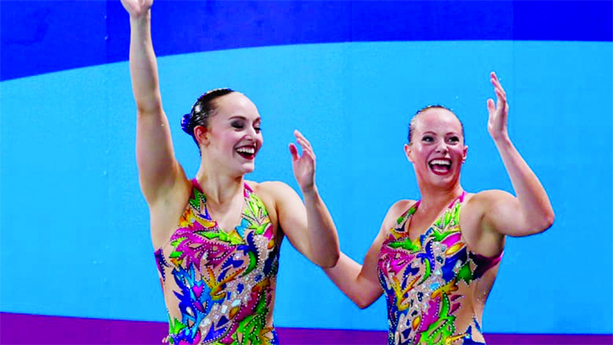 Canada's Claudia Holzner and Jacqueline Simoneau celebrate winning the gold medal in the artistic swimming duet technical routine final at the Pan American Games in Lima, Peru on Wednesday.