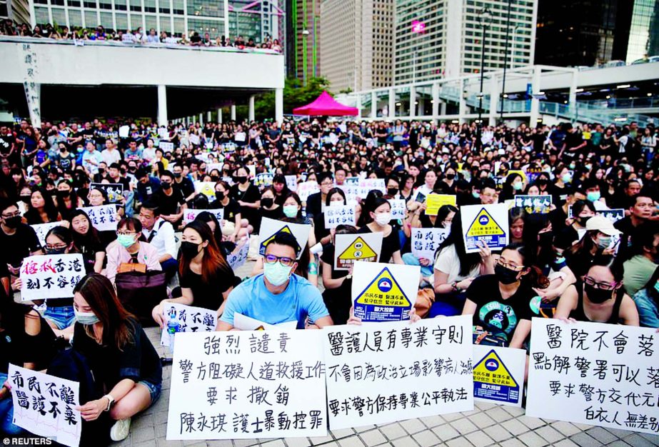 Members of Hong Kong's medical sector attend a rally to support the anti-extradition bill protest in Hong Kong on Friday.