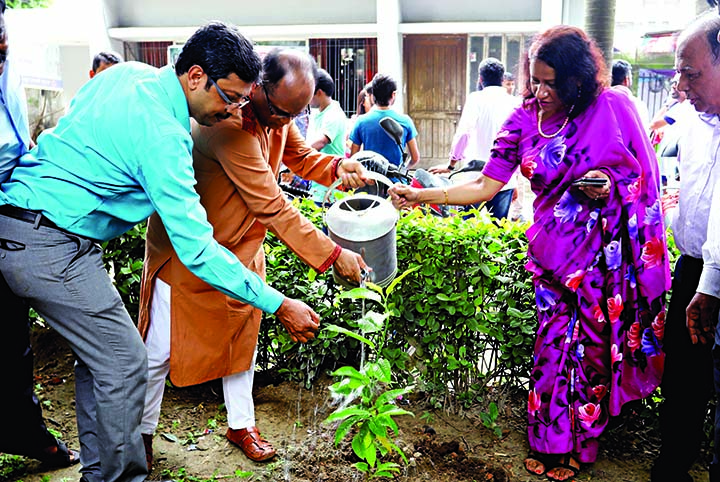 President of the Jatiya Press Club Saiful Islam watering a sapling after planting it on the Jatiya Press Club premises on Saturday as part of tree plantation programme.