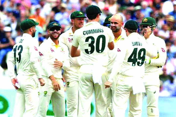 Australian off-spinner Nathan Lyon (3rd from right) celebrates his dismissal of England's Moeen Ali (not in picture) on the third day of first Ashes Test at Edgbaston on Saturday.