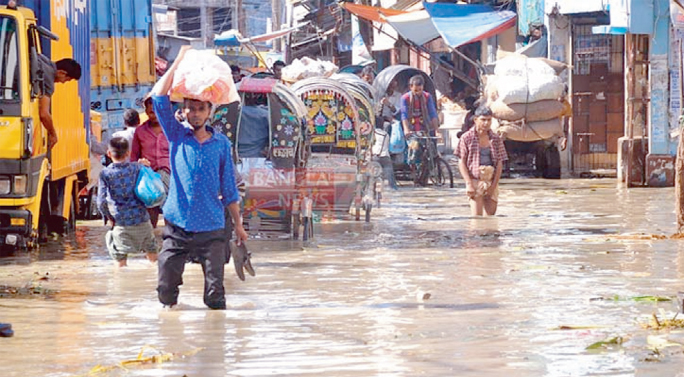 This is not flood ravaged scenario rather tide water of sea which submerged the central wholesale hub of the commodities - Chaktai and Khatungonj.The picture was taken on Saturday evening from Chaktai-Khatungonj area. The high tide water of the Bay sever