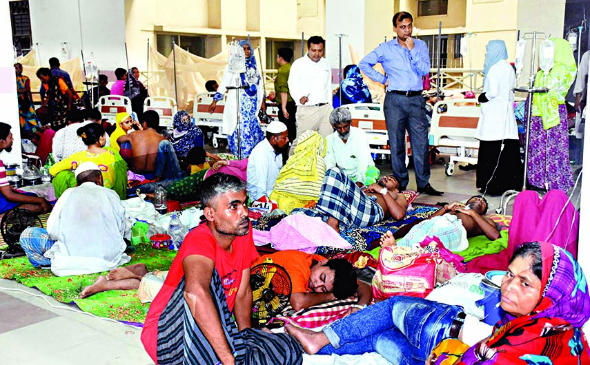 As government hospitals have run out of beds for patients seeking treatment for dengue, corridors and verandas in the hospitals have been converted into wards to accommodate them. This photo was taken from Mugdapara Hospital on Sunday.