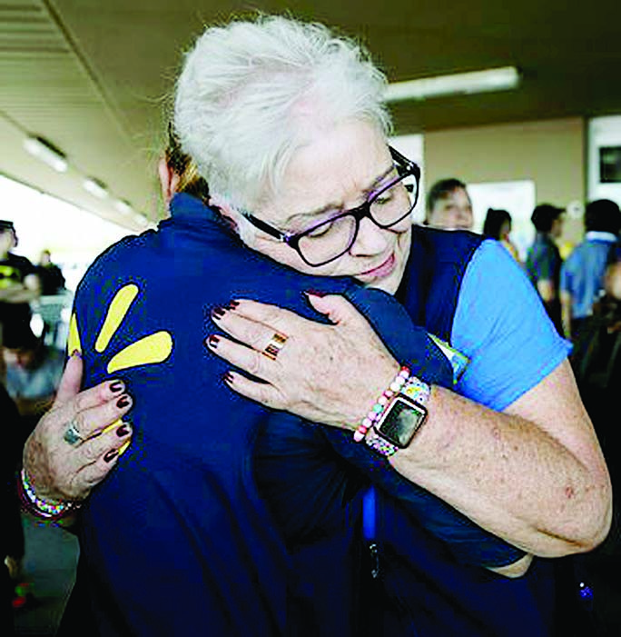 Two Walmart employees comfort one another outside the El Paso mall in the wake of the shooting's aftermath Internet photo