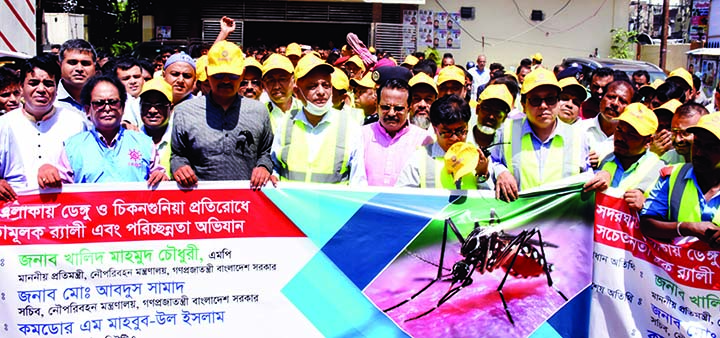 State Minister for Shipping Khalid Mahmud Chowdhury, among others, at a cleanliness campaign to resist dengue and chikunguniya in the city's Sadarghat area on Monday.