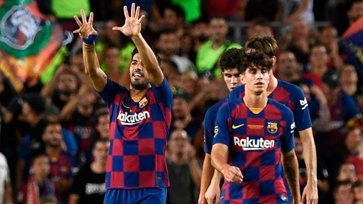 Luis Suarez (left) struck in the final minute of the match as Barcelona came from behind to beat Arsenal 2-1 in the Joan Gamper Trophy at Camp Nou on Sunday.