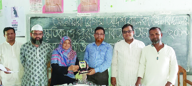 FENI: Rashada Akhter, Acting Head Mistress of Anowara Begum Adarsha Girlsâ€™ High School is being greeted at the prize distribution and cultural programme of the School on Saturday. Al Momin, Upazila Higher Secondary Education Officer was present