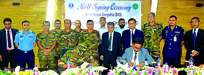 Arun Kumar Chowdhury, General Manager of Bangladesh House Building Finance Corporation (BHBFC) and Colonel Md Mahmudur Rahman, General Manager of Sena Kalyan Sangstha, signing an agreement at SKS Tower in the city recently. BHBFC Chairman Prof Dr Md Salim