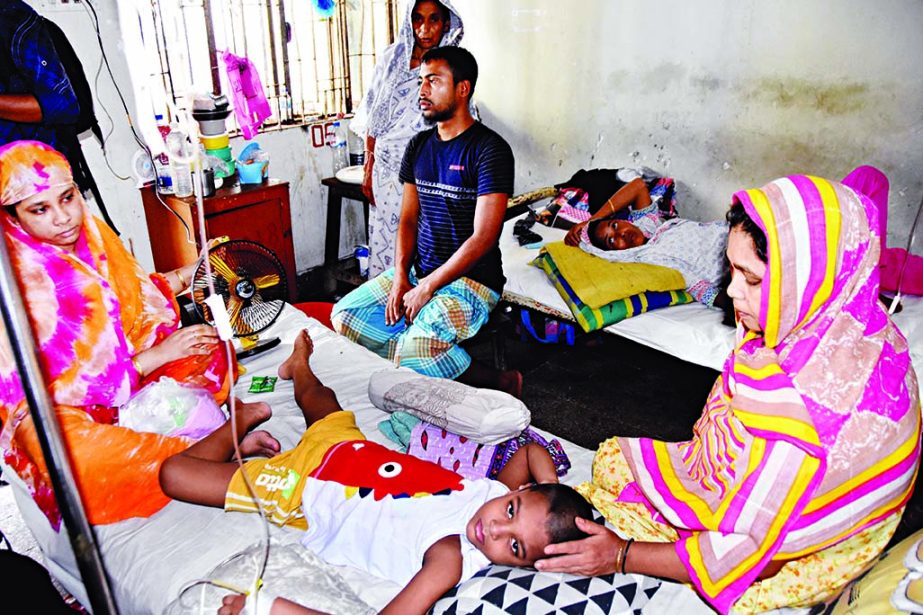 A kid lies on bed of the city's National Hospital suffering from dengue fever as the mosquito-borne disease taking its toll on children.
