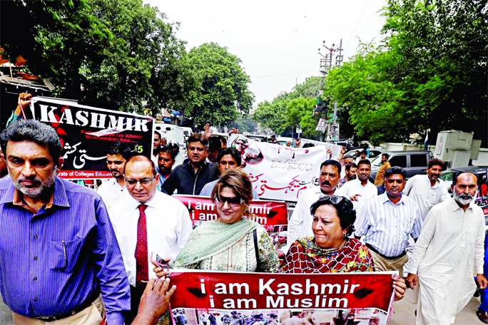 Demonstrators chant slogans as they march in solidarity with the people of Kashmir during a rally in Karachi on Monday.